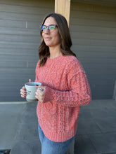 Load image into Gallery viewer, Woman in a pink sweater holding a coffee cup outdoors.