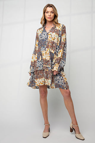 Woman wearing a patterned dress on a white background