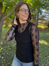 Load image into Gallery viewer, Woman wearing a black lace top and sunglasses outdoors with trees in the background
