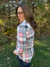 Load image into Gallery viewer, Woman wearing a plaid shirt outdoors with trees in the background
