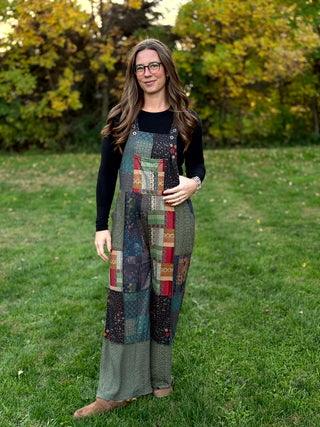 A lady wearing a knit patchwork overall.