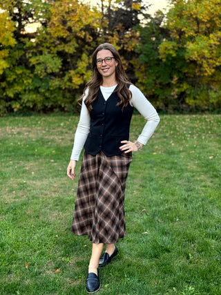 Shop our diagonal plaid A-line maxi skirt. Perfect for fall, this high-waisted brown skirt offers a flattering fit and timeless style. Elevate your look now!
