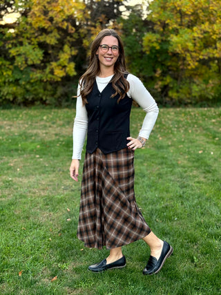 Shop our diagonal plaid A-line maxi skirt. Perfect for fall, this high-waisted brown skirt offers a flattering fit and timeless style. Elevate your look now!