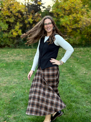 Shop our diagonal plaid A-line maxi skirt. Perfect for fall, this high-waisted brown skirt offers a flattering fit and timeless style. Elevate your look now!