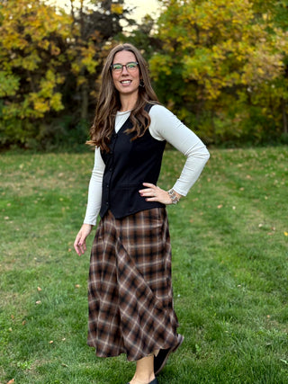 Shop our diagonal plaid A-line maxi skirt. Perfect for fall, this high-waisted brown skirt offers a flattering fit and timeless style. Elevate your look now!