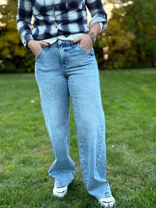 Elevate your denim collection with these KanCan wide-leg jeans featuring a unique boho-inspired whip stitch side detail. The flattering high-rise silhouette and vintage light wash deliver effortless style and premium comfort for any occasion.