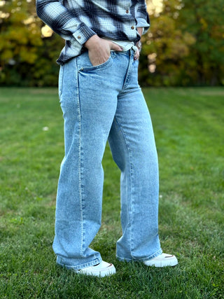 Elevate your denim collection with these KanCan wide-leg jeans featuring a unique boho-inspired whip stitch side detail. The flattering high-rise silhouette and vintage light wash deliver effortless style and premium comfort for any occasion.