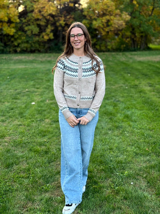 Embrace seasonal charm with this timeless Nordic-inspired snap cardigan. Crafted for cozy warmth, its intricate Fair Isle pattern and easy-front closure make it the ultimate effortless layer for chilly days.