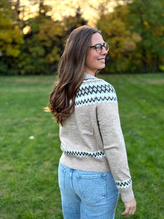 Embrace seasonal charm with this timeless Nordic-inspired snap cardigan. Crafted for cozy warmth, its intricate Fair Isle pattern and easy-front closure make it the ultimate effortless layer for chilly days.