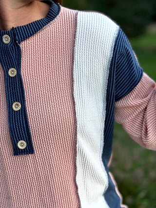 Elevate your everyday rotation with this chic colorblock waffle knit Henley, featuring a sophisticated pink and cream palette. This breathable, textured long sleeve blends cozy comfort with a polished aesthetic, making it the ultimate transition piece for any season.