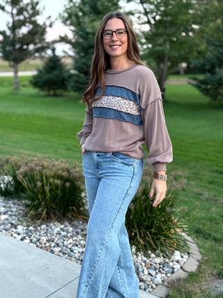 Elevate your everyday style with this cozy waffle-textured top featuring charming floral stripes and chic denim-blue accents. Its relaxed drop-shoulder fit and feminine details offer effortless comfort for seamless seasonal layering.