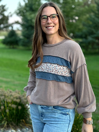 Elevate your everyday style with this cozy waffle-textured top featuring charming floral stripes and chic denim-blue accents. Its relaxed drop-shoulder fit and feminine details offer effortless comfort for seamless seasonal layering.