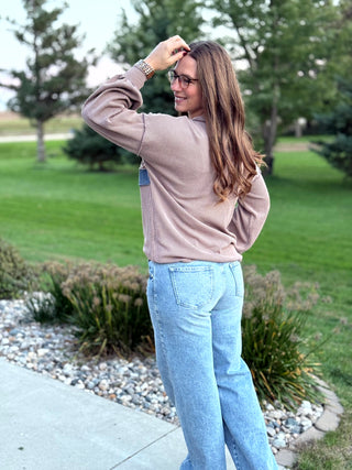 Elevate your everyday style with this cozy waffle-textured top featuring charming floral stripes and chic denim-blue accents. Its relaxed drop-shoulder fit and feminine details offer effortless comfort for seamless seasonal layering.