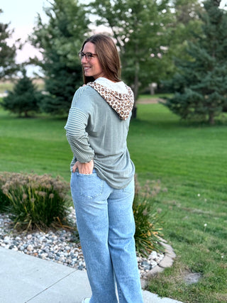 Shop our Sage & Wild Leopard Mixed Media Hoodie. Featuring stripes, animal print accents, and a button neckline, it's the perfect cozy everyday top for women.