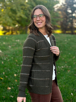 Angled front view of a dark olive striped open-front cardigan with patch pockets and ribbed cuffs.