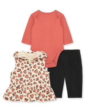 Baby outfit set with pink onesie, heart-patterned dress, and black pants on a white background