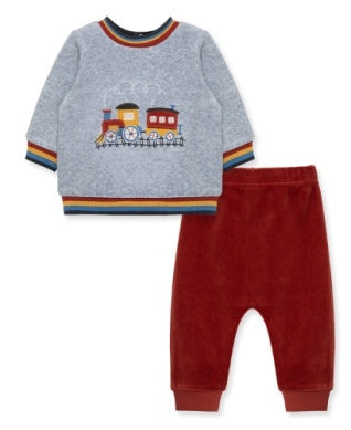 Children's outfit with a gray sweater with train design and red pants on a white background
