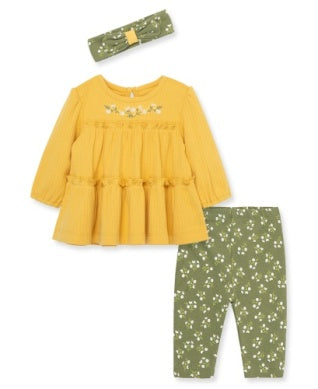 Yellow top and green floral pants with matching headband on a white background