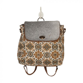 Patterned bag with a textured flap on a white background