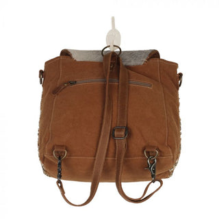 Patterned bag with a textured flap on a white background