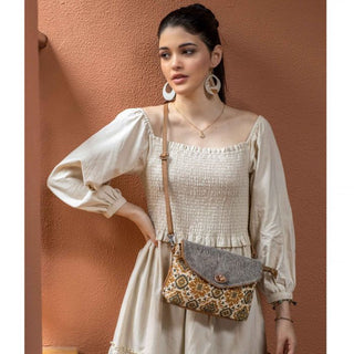 Flap-over handbag with patterned front and gray top, on a white background