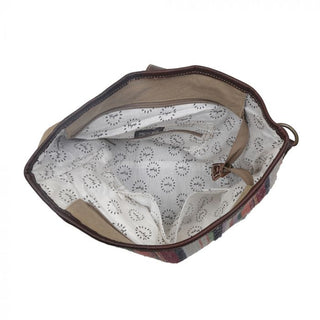 Multicolored striped bucket bag with brown leather accents on a white background
