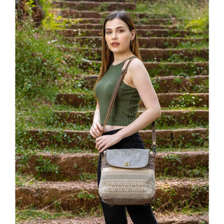 Gray and patterned fabric crossbody bag on a white background